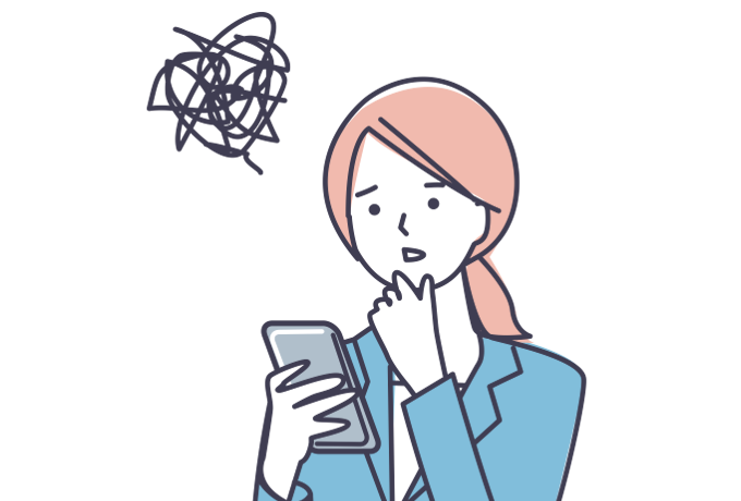 スマホを見ながら困惑する女性